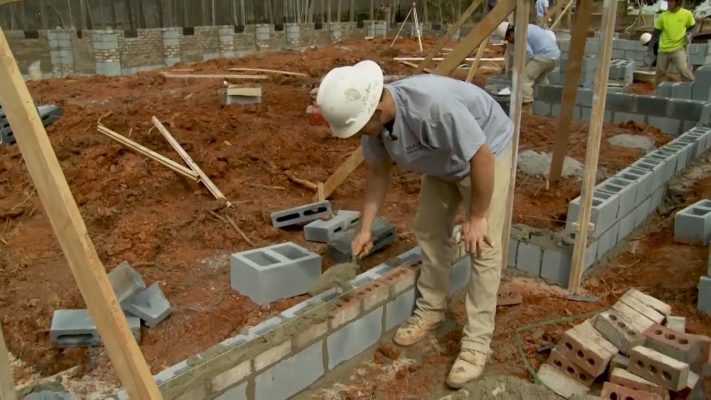 Brickmason building a wall